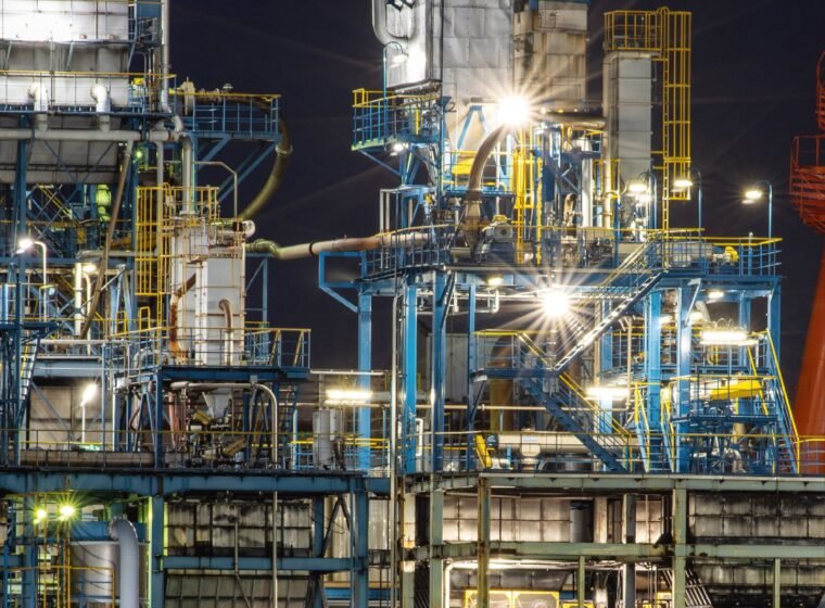 Petrochemical process unit illuminated by explosion-proof LED floodlights at night